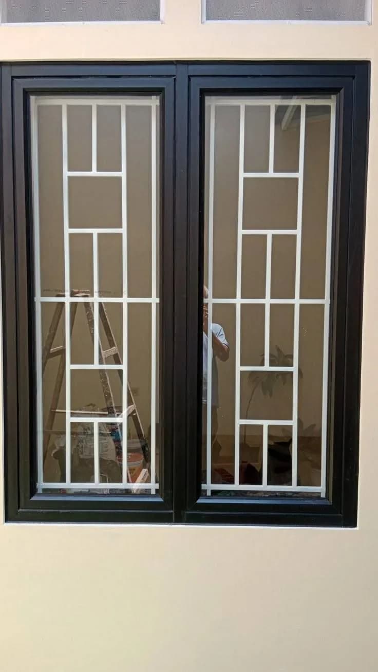 Teralis jendela dan pintu dengan motif belah ketupat susun tiga